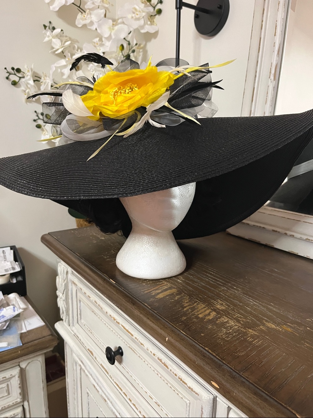 Large flop hat with large yellow flower.